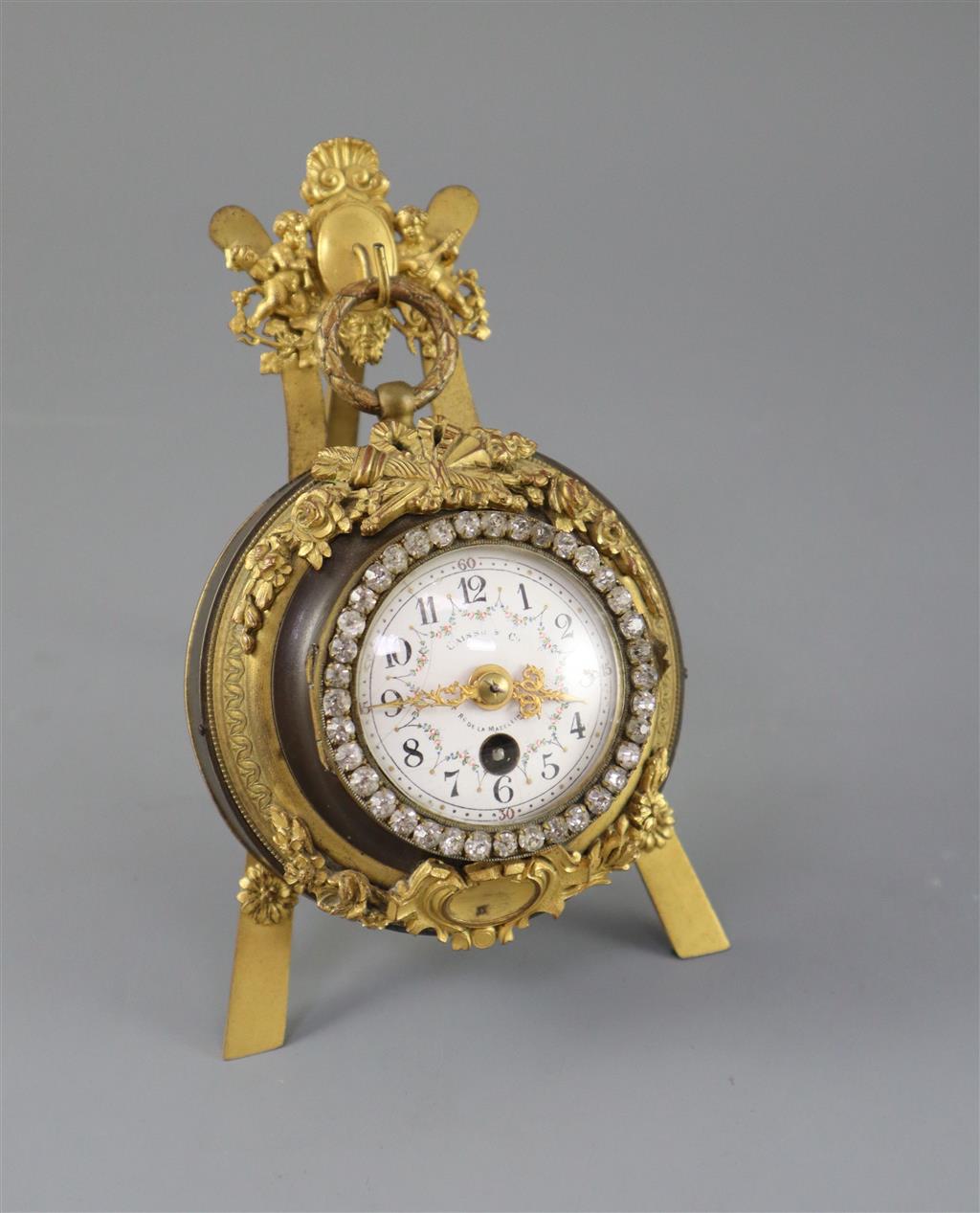 An early 20th century French bronze and ormolu desk timepiece, width 4.5in. overall height 6.25in.